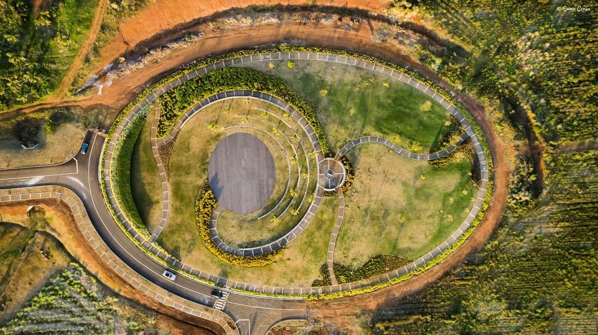 Aerial photograph of a circular earthwork in a green landscape